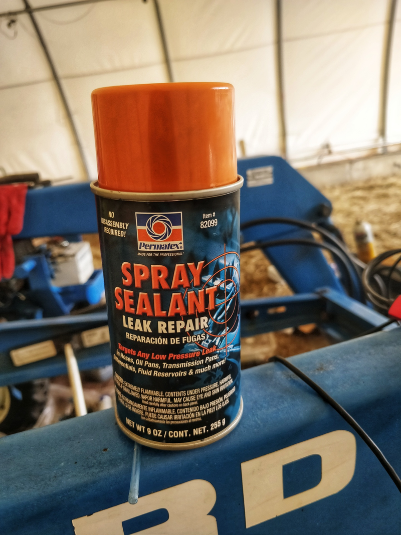 I cleaned the plug, pinged it back in tight with a punch and hammer (had to remove the hydraulic pump to reach) and then covered it up with this stuff.